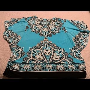 Printed Polyester Top with sparkly rhinestones. Very eye catching!